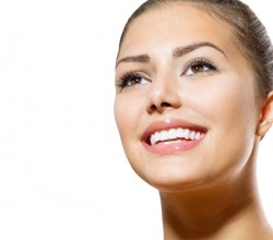 Teeth Whitening. Beautiful Smiling Young Woman Portrait